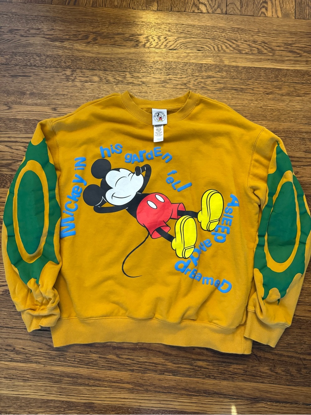 This item is a Disney Parks Mickey & Co. Mustard Fleece Pullover Sweatshirt